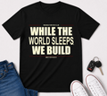 While The World Sleeps We Build T-Shirt | Motivational Typographic Tee